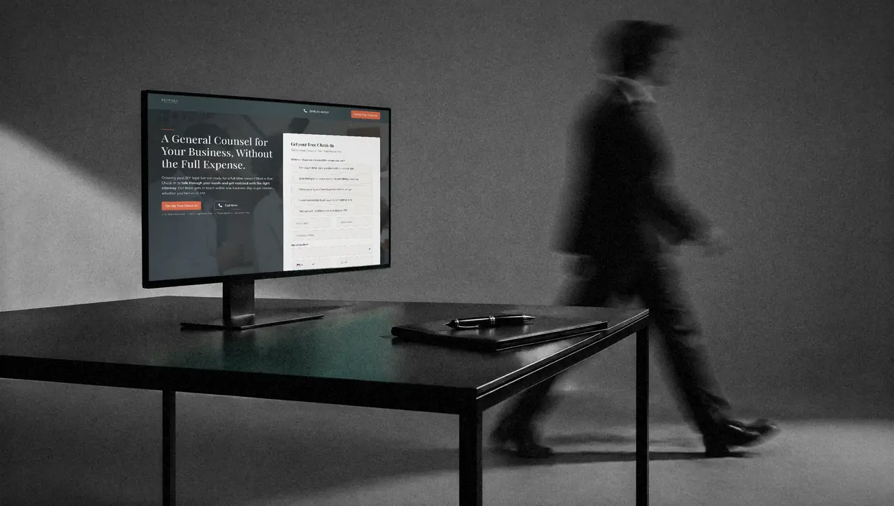 Bespoke Legal landing page shown on a studio display